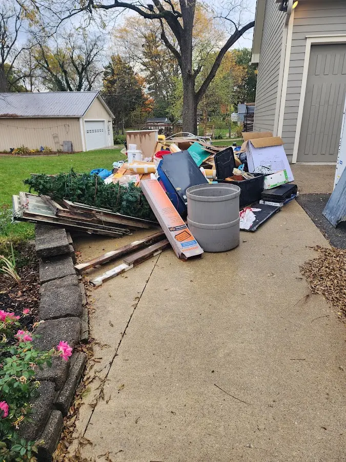 Dumpster being loaded with debris for 3 Yard Dumpster Rental in Spencerport